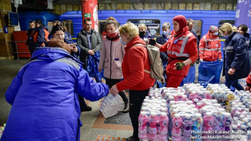 Ukrainian Red Cross volunteers provide people sheltering in a subway station with food and basic necessities.
